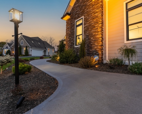 Landscape Lighting4 Landscape lighting illuminating a home with a walkway