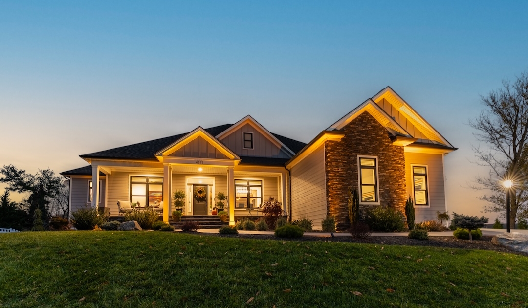 Low-voltage landscape lighting illuminating a home in Rockingham County, VA installed by Shreckhise Landscape & Design