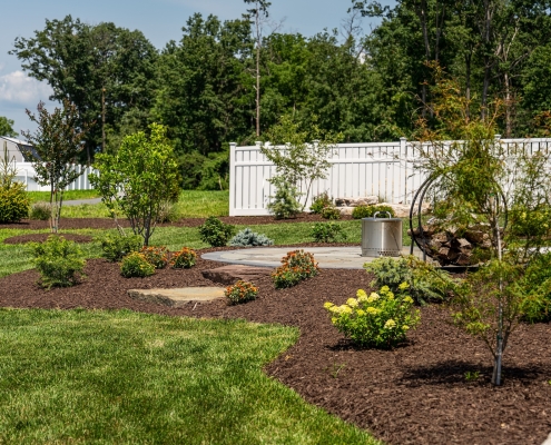 Shreckhise_McGraw_After-38 A view of a home's back patio with landscaping and hardscaping.