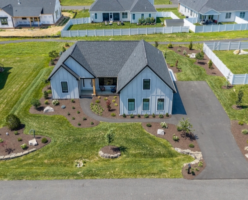 default an aerial view of a front yard with hardscape and plant beds.